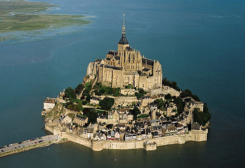 Mont Saint-Michel, located one kilometre off France's northwestern coast, at the mouth of the Couesnon River near Avranches, Normandy, France - www.castlesandmanorhouses.com